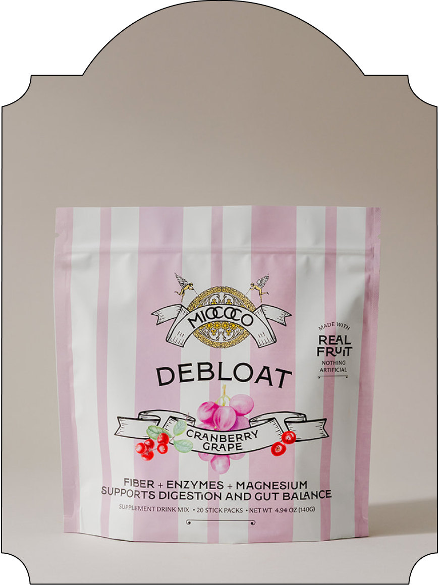 A stand-up pouch of Miococo DeBloat dietary supplement in Cranberry Grape flavor, featuring pink and white vertical stripes with the brand logo and product details on the front.