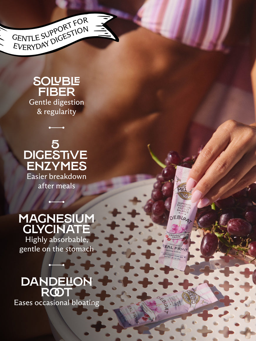 A person holding a pink and white packet of Debloat powder next to a bunch of dark grapes on a patterned table, with text overlays describing digestive benefits.