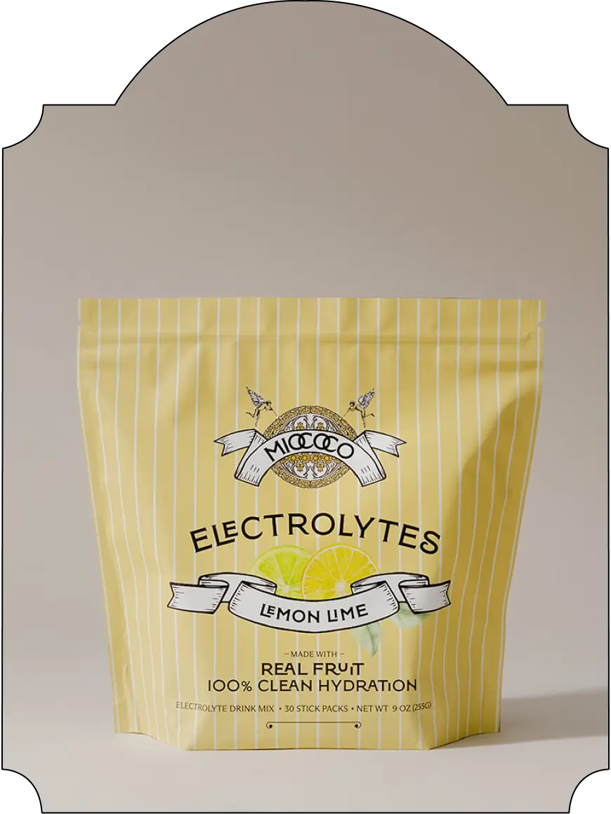 A stand-up pouch of MIOCOCO Electrolytes in Lemon Lime flavor, featuring a pale yellow and white striped design with a lemon graphic and black text, set against a neutral beige background.