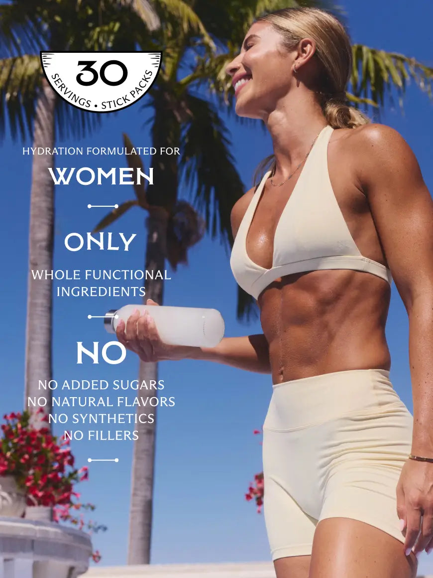A woman in a sports bra and matching shorts stands outdoors against a blue sky and palm tree, holding a clear water bottle. Large text on the left reads '30 Servings • Stick Packs' and 'Hydration Formulated for Women' 'only whole functional ingredients with no added sugars no natural flavors no synthetics no fillers.'