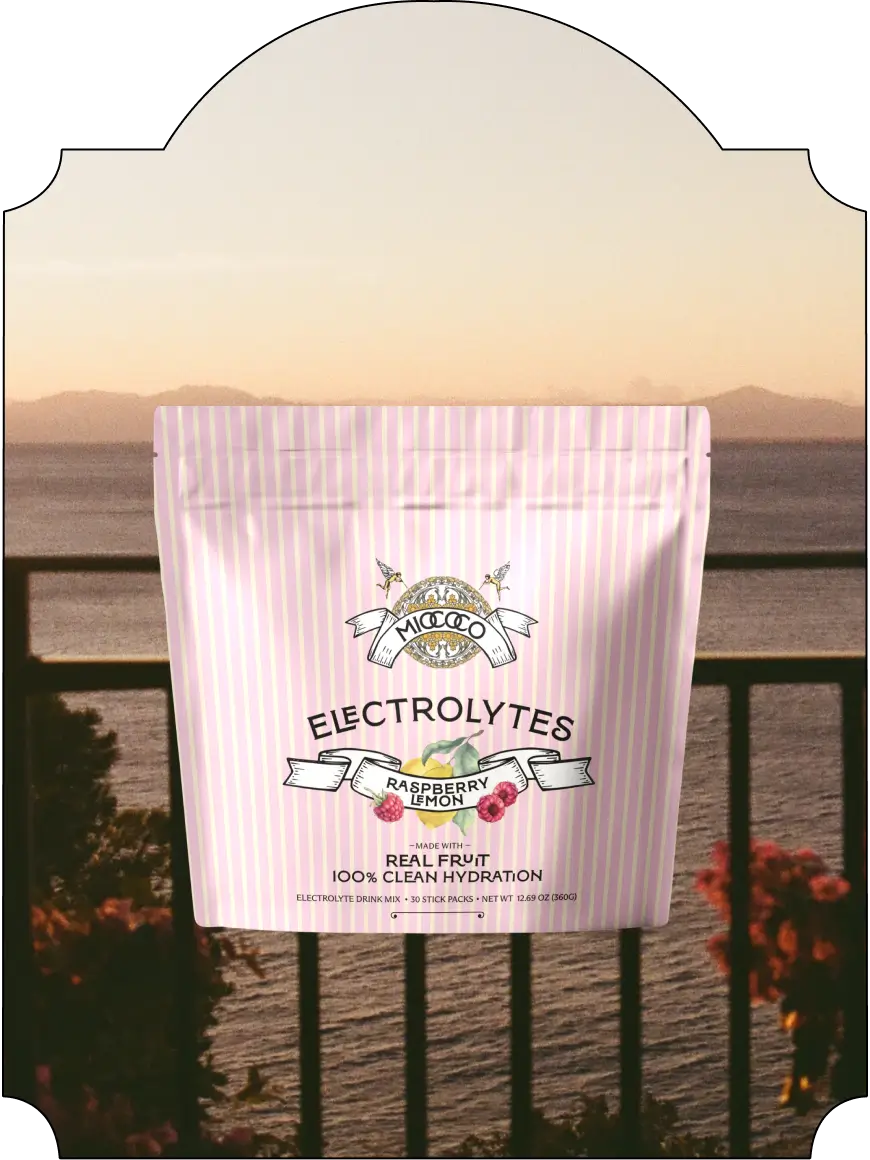 Raspberry lemon electrolytes packet against a scenic background